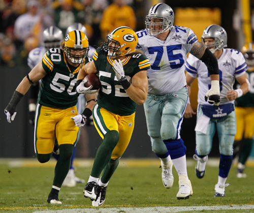 With linebacker A.J. Hawk blocking Green Bay Packers linebacker Clay 